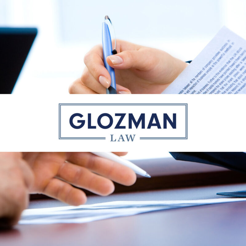 Two people signing contract